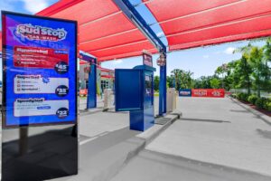Sud Stop Car Wash unlimited wash plan signage at a store